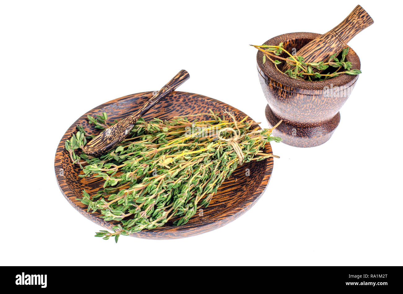 Thyme sprigs, mortar, pestle, herb for cooking. Studio Photo Stock