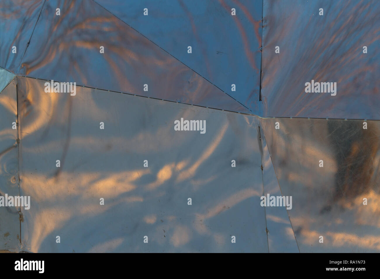 Sun Reflection Metal abstract metal background. sun is reflecting on it Stock Photo - Alamy