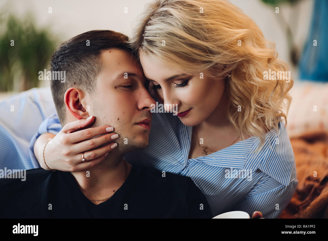 Handsome man touching girlfriend face hi-res stock photography and images -  Alamy