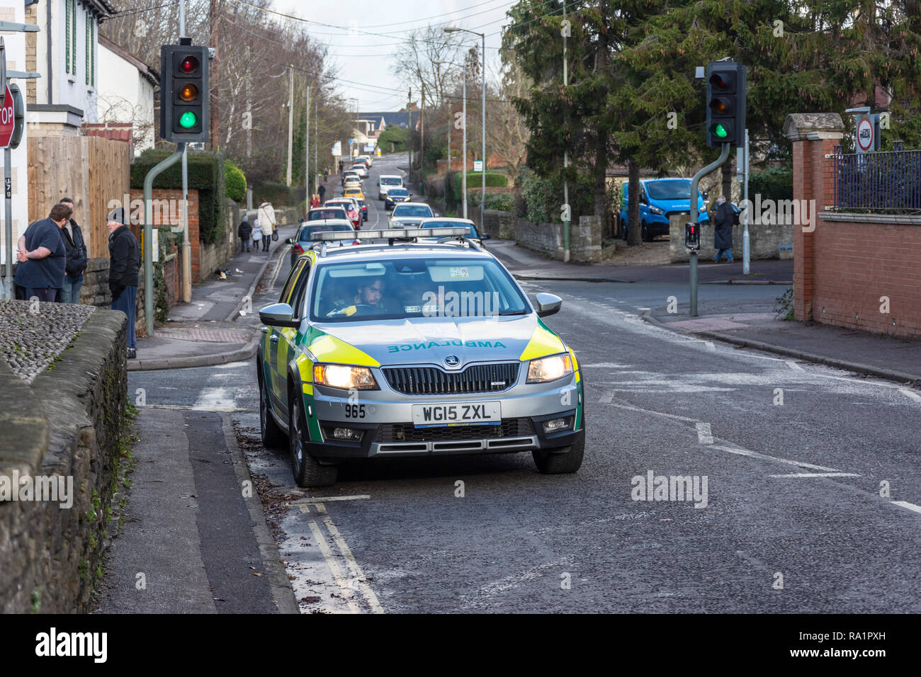 A fast response ambulance car parked near traffic lights after an emergency has been cleared Stock Photo