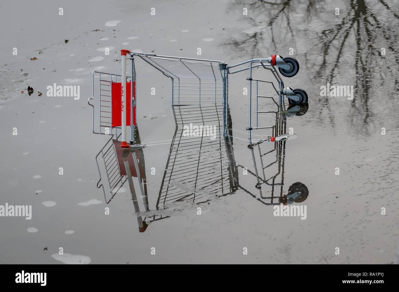 Someone has dumped a shopping cart. Stock Photo