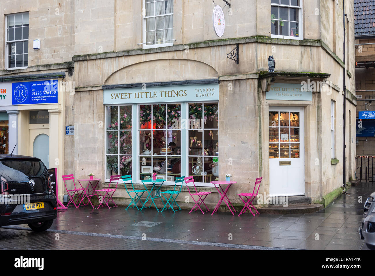 Sweet little things tea room and bakery with chairs and tables outside on Lower Borough Walls in the City of Bath on a wet winter morning Stock Photo