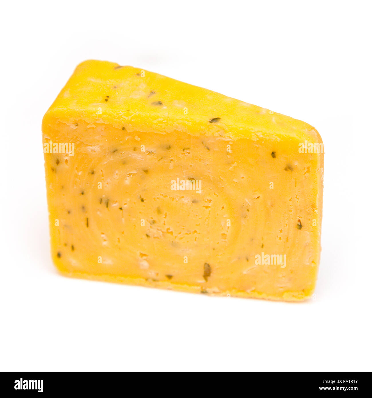 Double Gloucester cheese with onions and chives isolated on a white studio background. Stock Photo