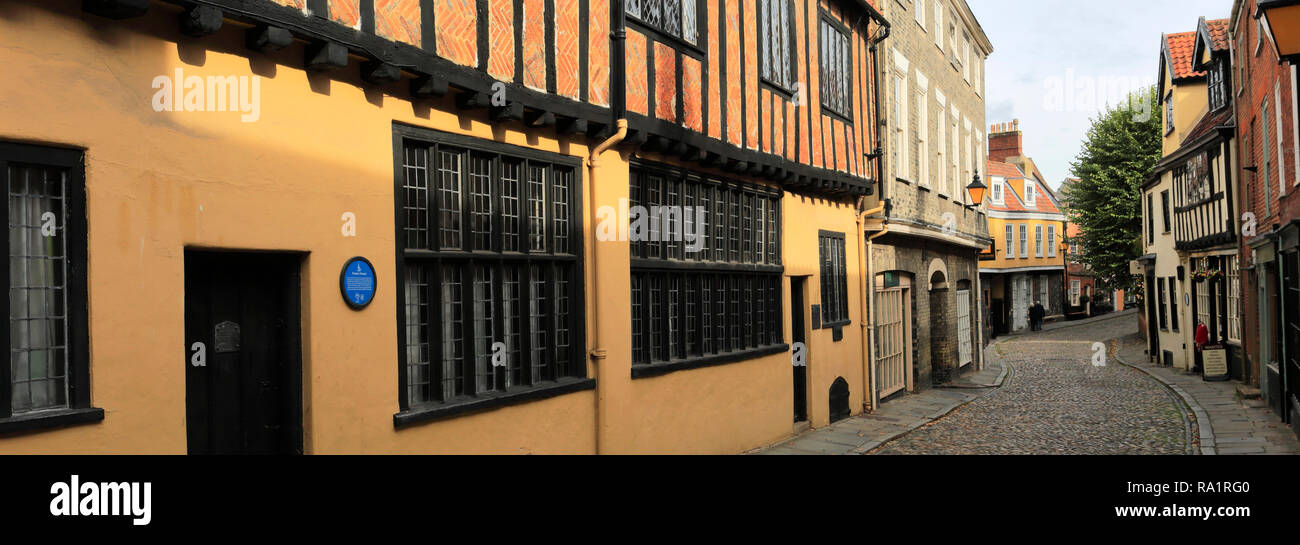 Architecture and shops along the narrow cobbled street of Elm Hill, the Lanes, Norwich City, Norfolk County, England, UK Stock Photo