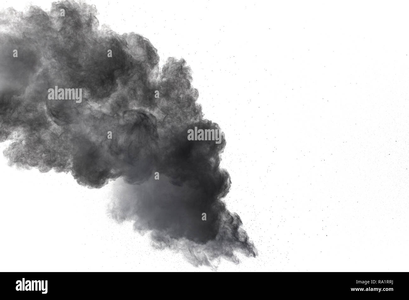 Black powder explosion. The particles of charcoal splatter on white background. Closeup of black dust particles splash isolated on  background. Stock Photo