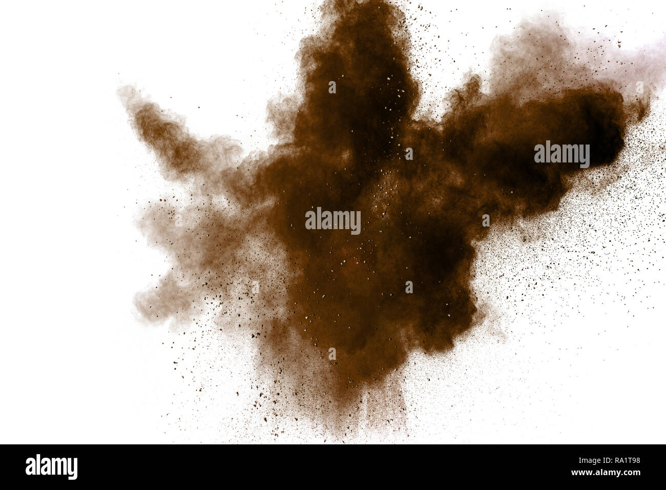 Freeze motion of brown dust explosion. Stopping the movement of brown powder. Explosive brown powder on white background. Dry soil splater on white ba Stock Photo