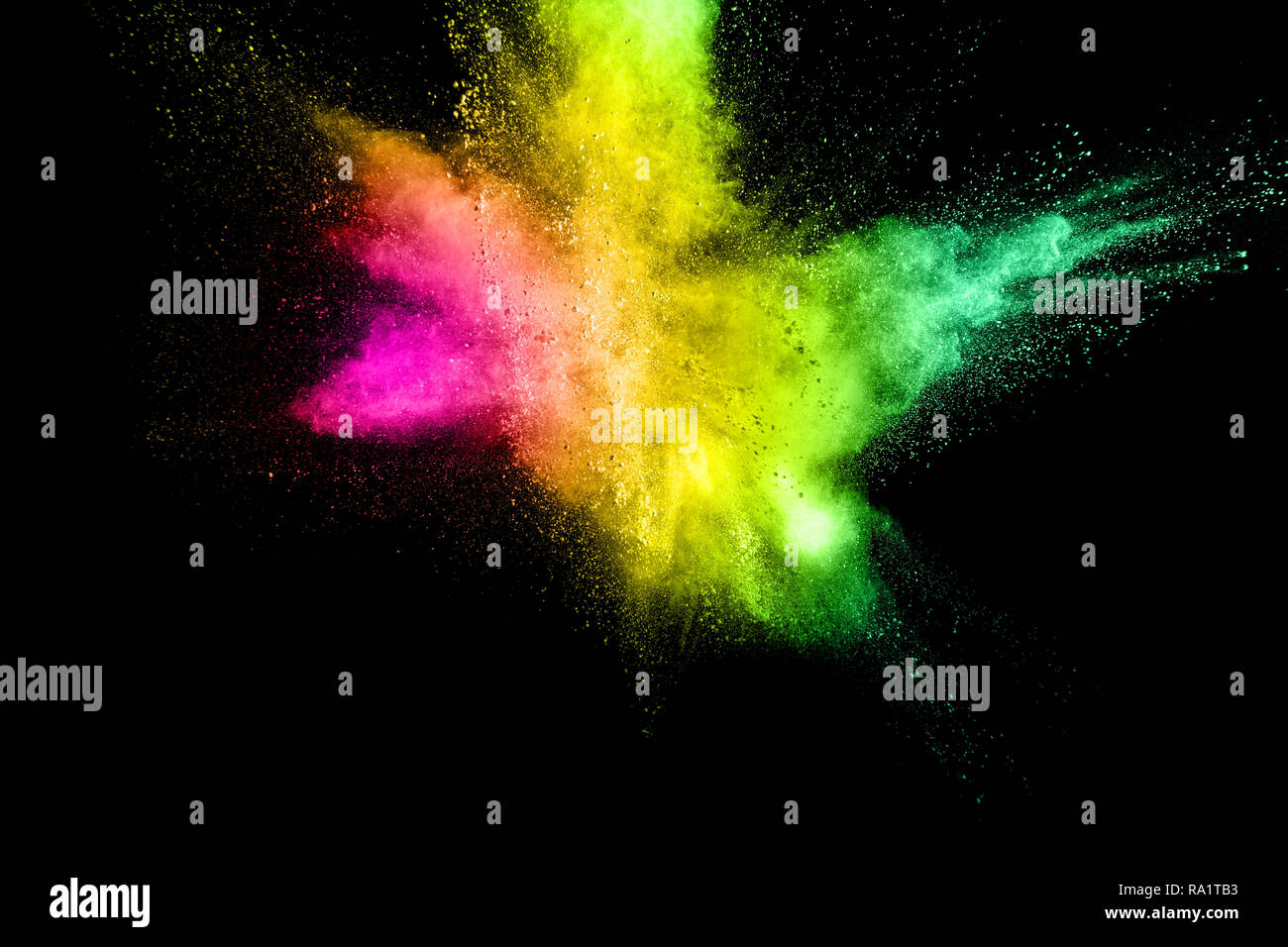 Abstract multicolored powder explosion on black background.  Freeze motion of color dust  particles splash. Painted Holi. Stock Photo