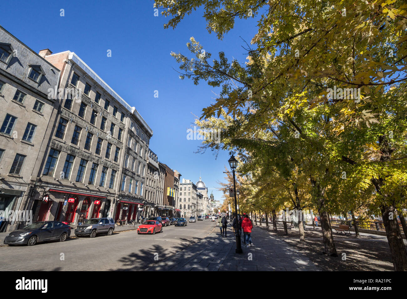 MONTREAL, CANADA - NOVEMBER 4, 2018: View of Old Montreal seafront, or Vieux Montreal, Quebec, in the autumn, with its yellow leaves trees and stone b Stock Photo