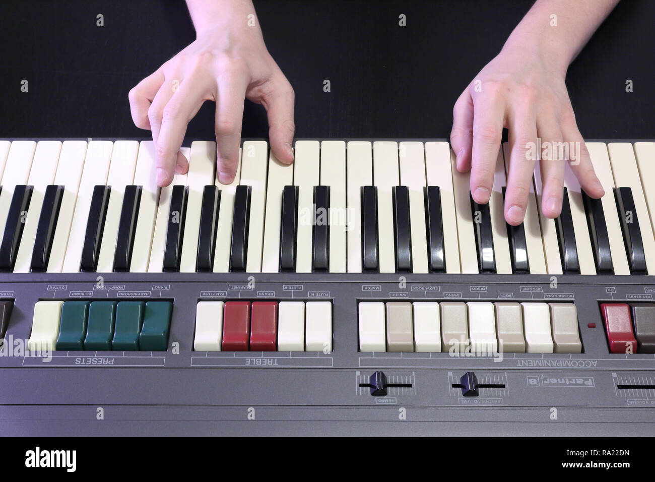 A right hand playing a E (MI) minor chord on an old black piano with  yellowed cracked keys, pressing the E (MI), G (SOL), B (SI) notes Stock  Photo - Alamy
