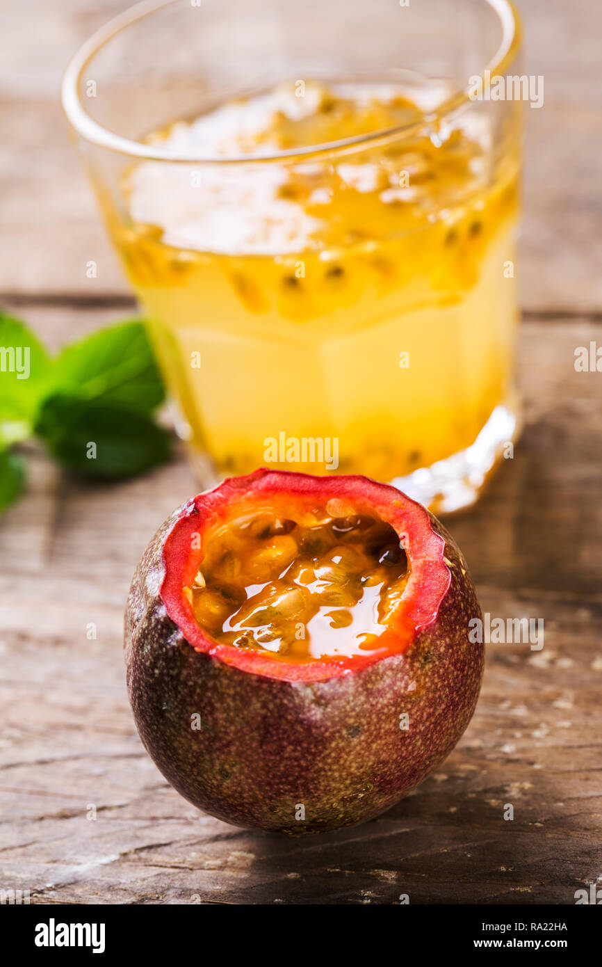 Glass of fresh passion fruit mint on table Stock Photo