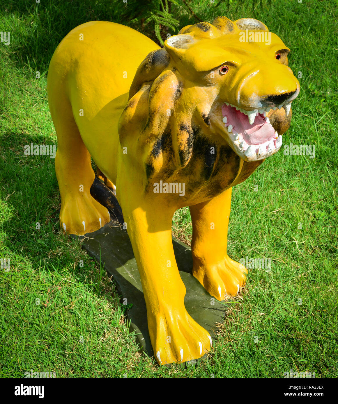 Golden Lion Statue Lion On The Floor Grass In The Garden Stock