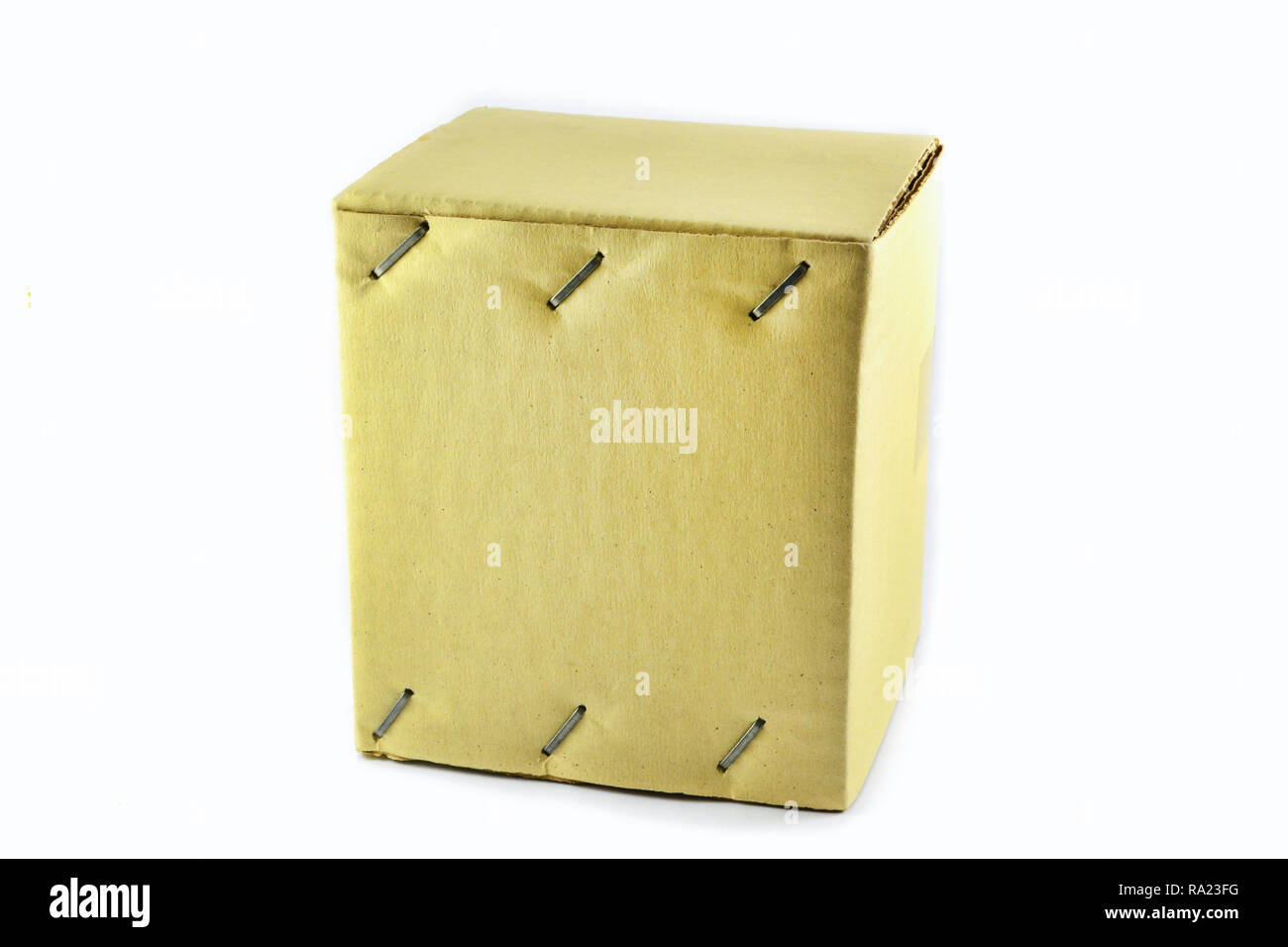 Cardboard box / Brown paper closed box package with Staples Stock Photo