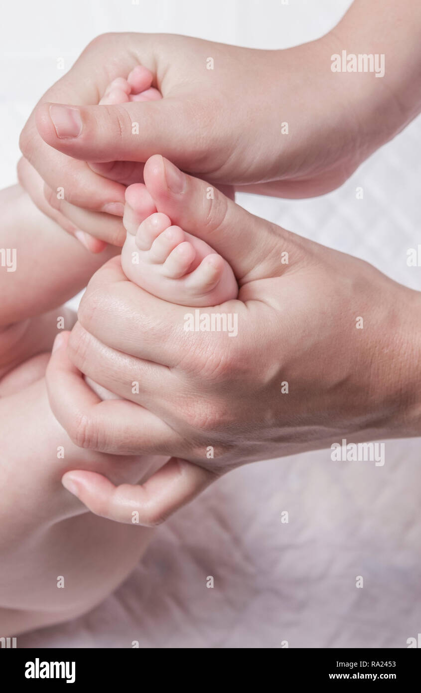 Feet Massage To 3 Month Baby Boy Thumb Over Thumb Motion From Heel To Toes Stock Photo Alamy