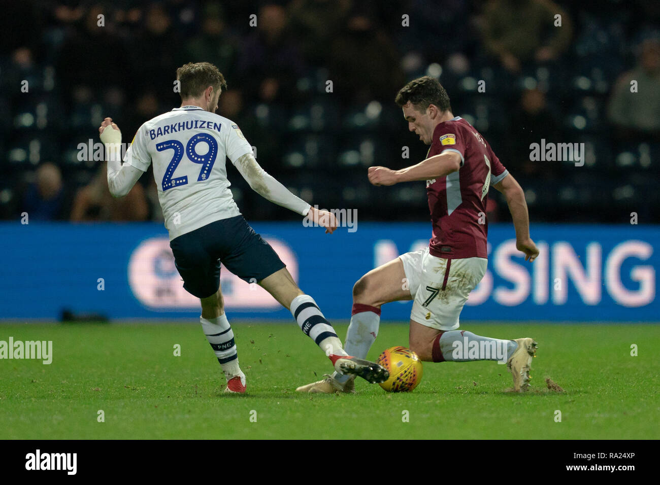 Aston Villa's John McGinn vies for possession with Preston North End's Tom Barkhuizen  29th December 2018, Deepdale, Preston, England; Sky Bet Championship, Preston North End vs Aston Villa ;    Credit: Terry Donnelly/News Images  English Football League images are subject to DataCo Licence Stock Photo