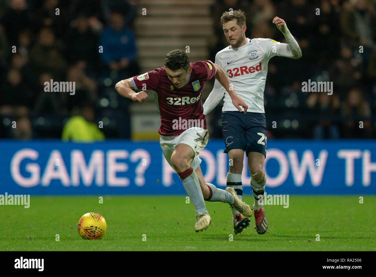 Aston Villa's John McGinn is tackled by Preston North End's Tom Barkhuizen  29th December 2018, Deepdale, Preston, England; Sky Bet Championship, Preston North End vs Aston Villa ;    Credit: Terry Donnelly/News Images  English Football League images are subject to DataCo Licence Stock Photo