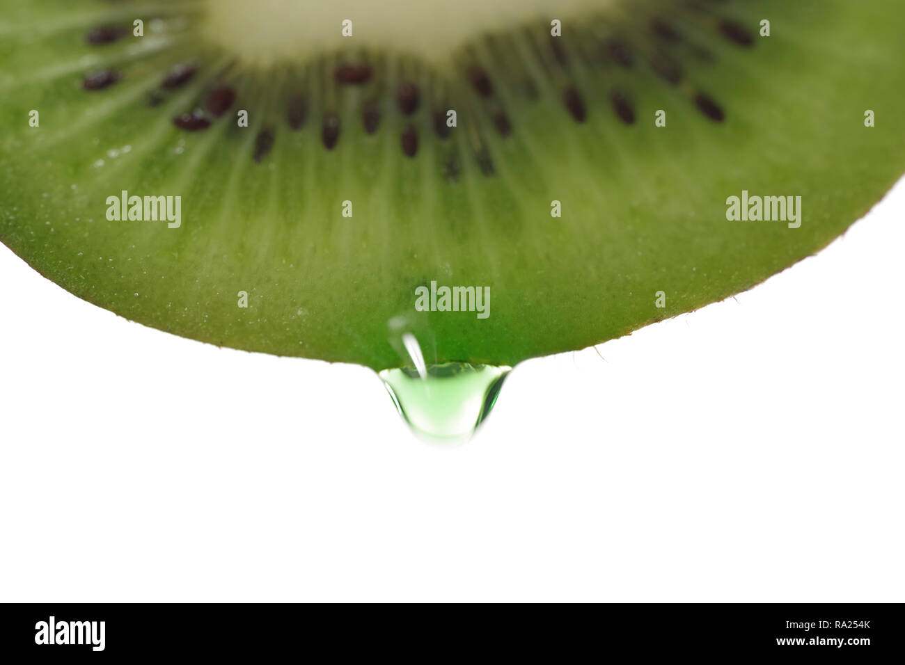 kiwi with dripping clear juice on white background Stock Photo
