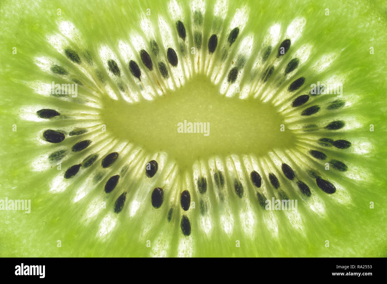 background with cut kiwi fruit macro Stock Photo