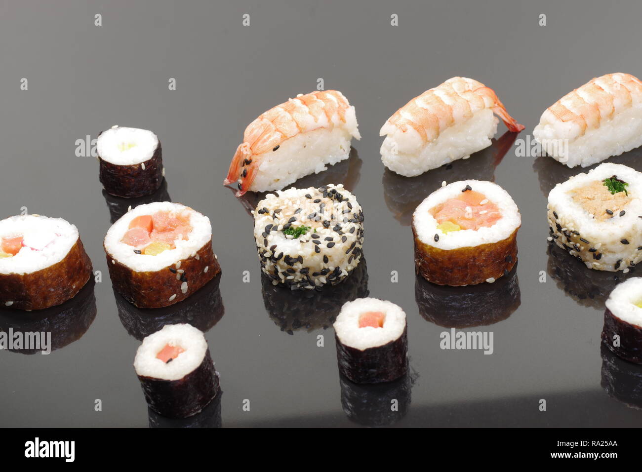 portion sushi on black plate Stock Photo