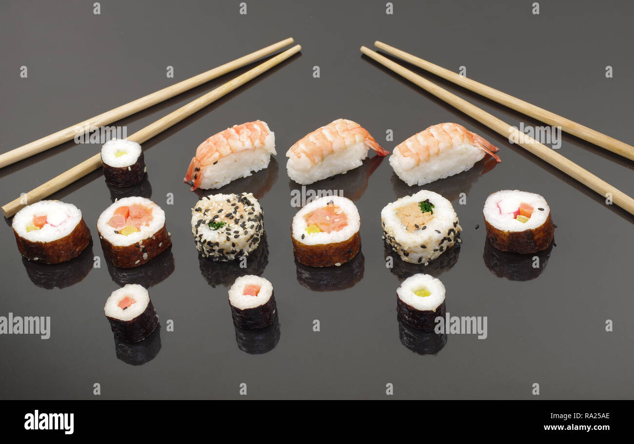 portion sushi on black plate Stock Photo