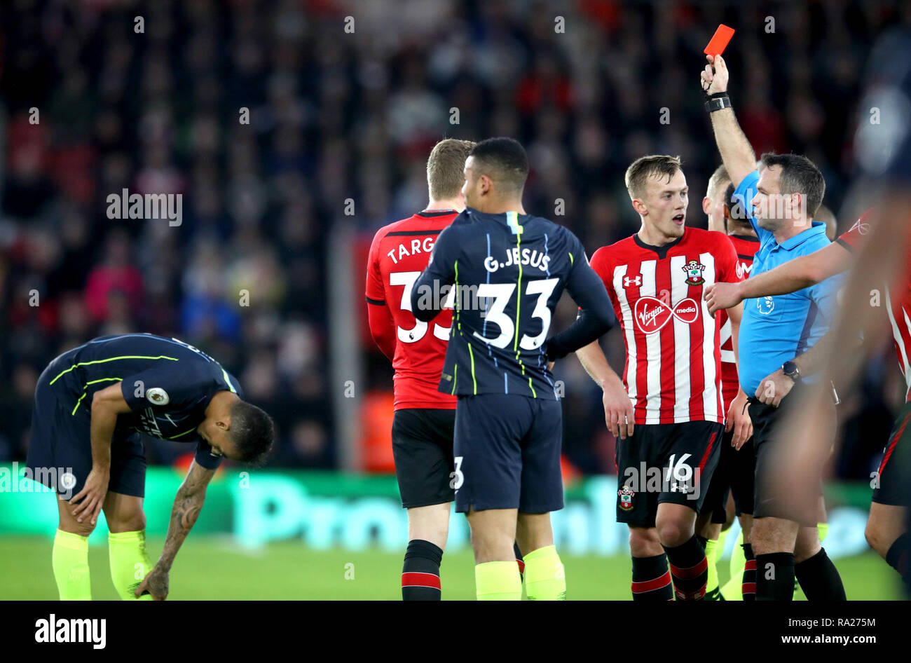 Referee Paul Tierney shows a red card to Southampton's Pierre-Emile ...