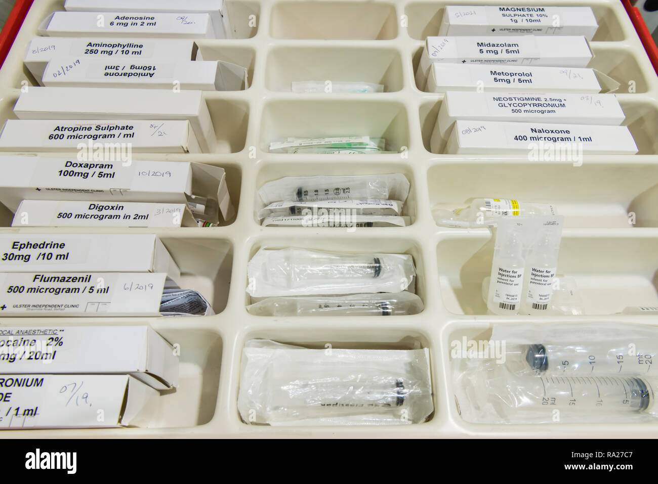 Drawer in a hospital crash trolley for emergency resuscitation containing drugs. Stock Photo
