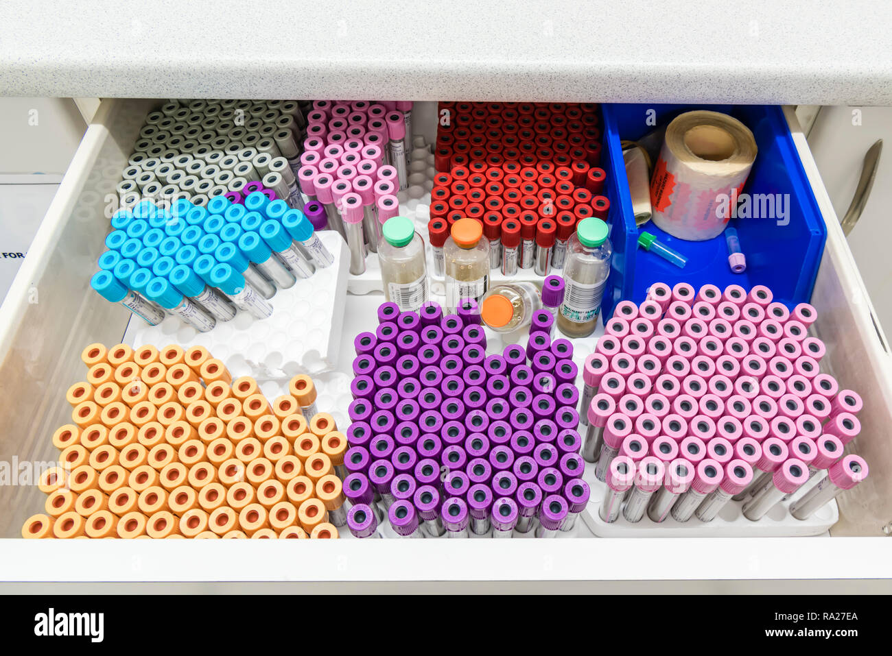 Drawer in a hospital treatment room containing different types of Vacutainers for taking blood samples. Stock Photo