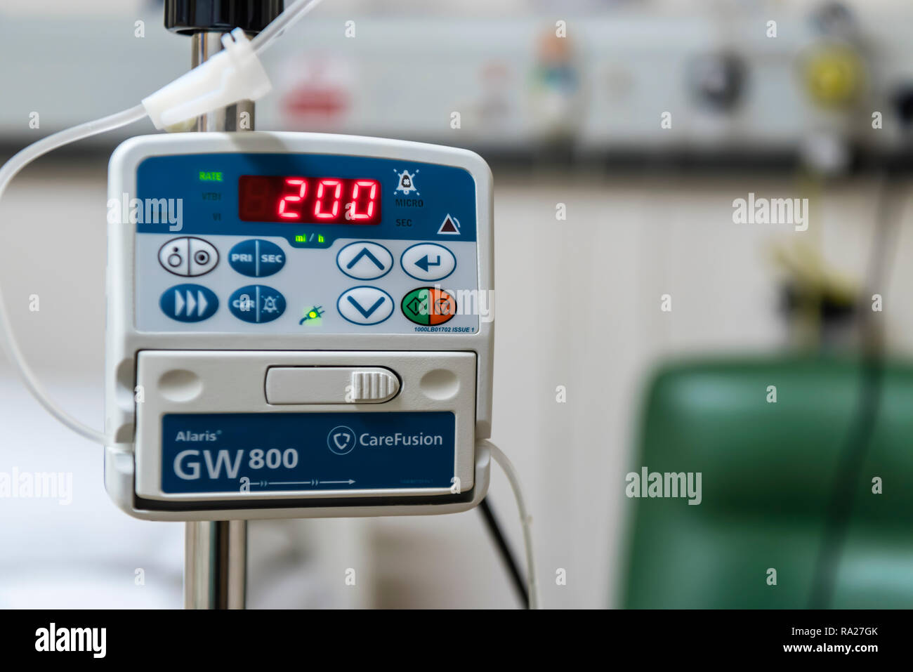 Drip infusion pump in a hospital ward, used to deliver controlled doses of fluids and medicines. Stock Photo