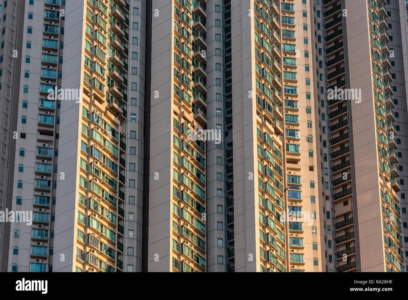 The seemingly endless wall of humanity that form the Victoria Towers high rise residential development on Canton Road in Tsim Sha Tsui, Hong Kong Stock Photo