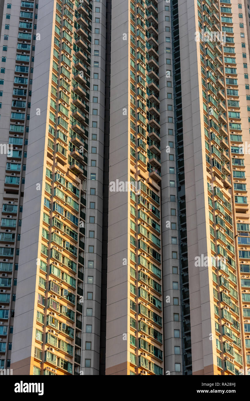 The seemingly endless wall of humanity that form the Victoria Towers high rise residential development on Canton Road in Tsim Sha Tsui, Hong Kong Stock Photo