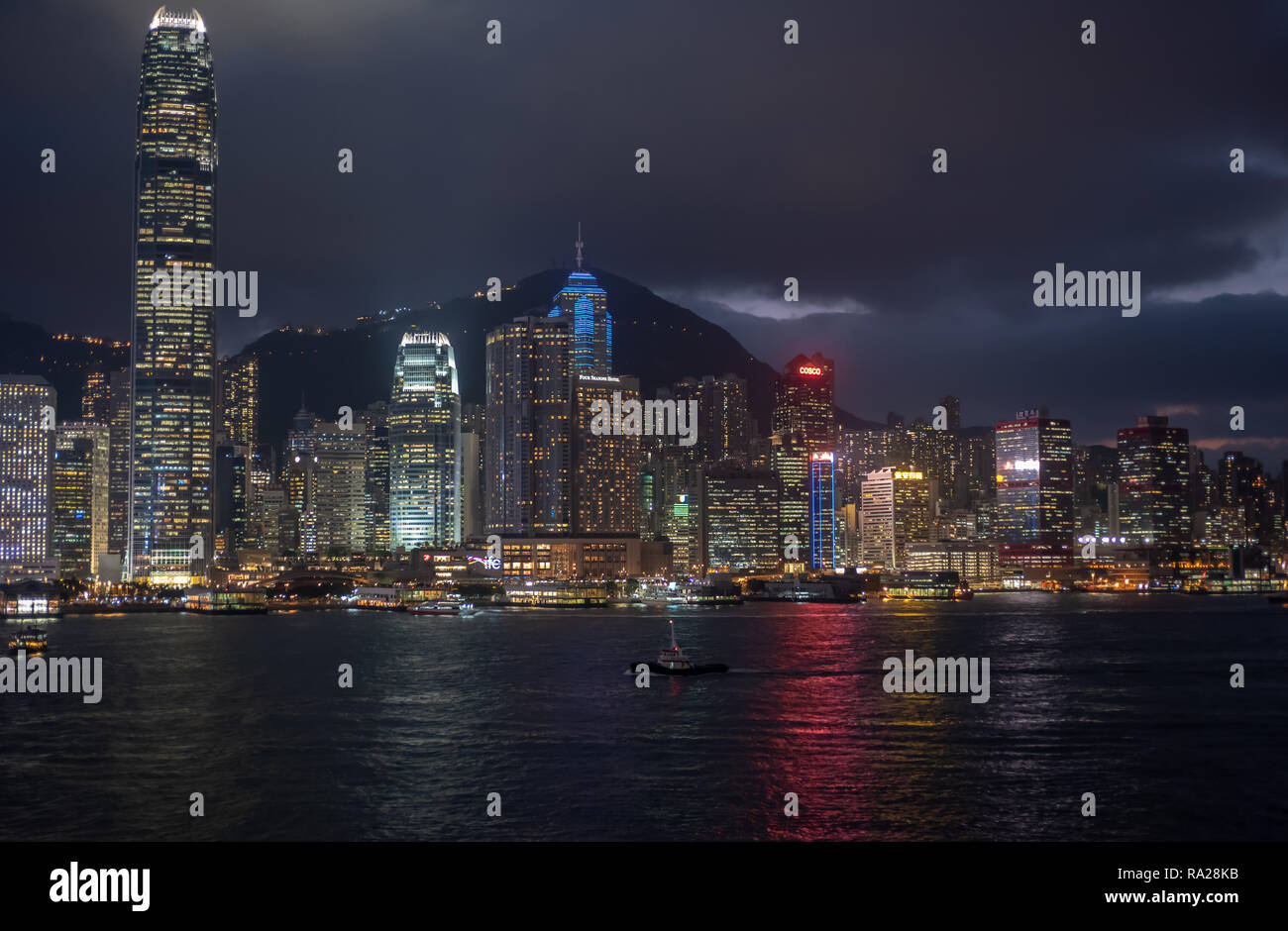The spectacular Hong Kong skyline at night with the towers of Central District and Sheung Wan appearing to rise up to the Peak in the background Stock Photo