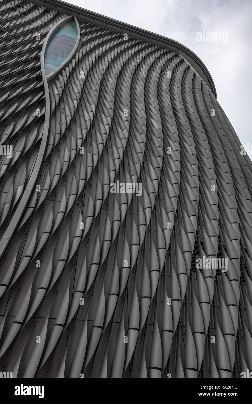 The dramatic scale-like aluminium facade of the Xiqu Centre together with it's eye-like aperture turns the building into a giant metal reptile. Stock Photo