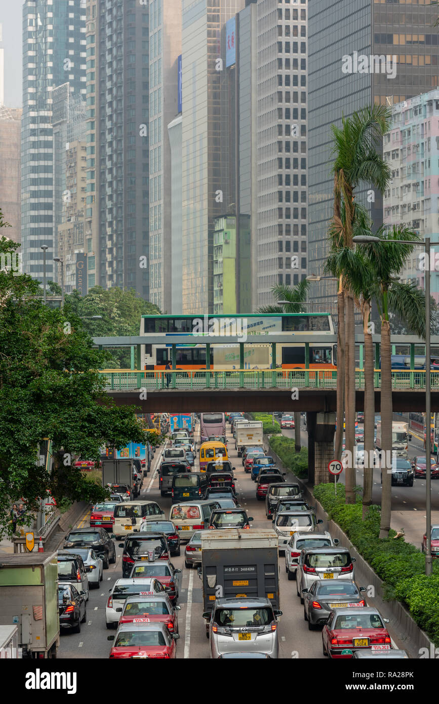 Lines of traffic fill Gloucester Road as they queue to enter the Cross-Harbour Tunnel Stock Photo