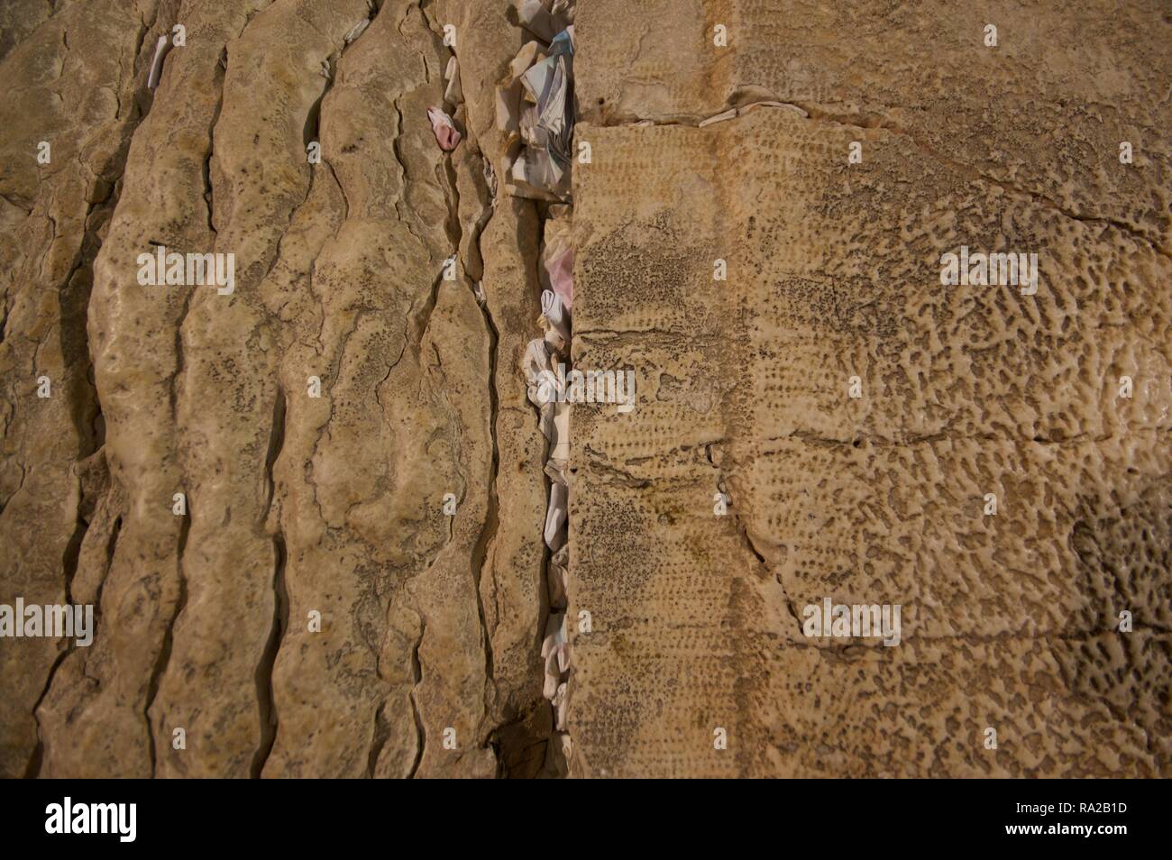 Paper petitions jammed into the cracks of the western wall, Jerusalem Stock Photo