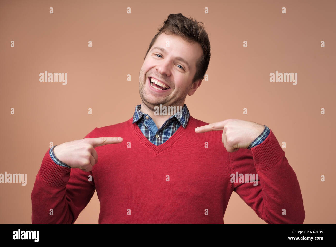 Young business man, funny looking guy asking question, you talking to me, you mean me Stock Photo