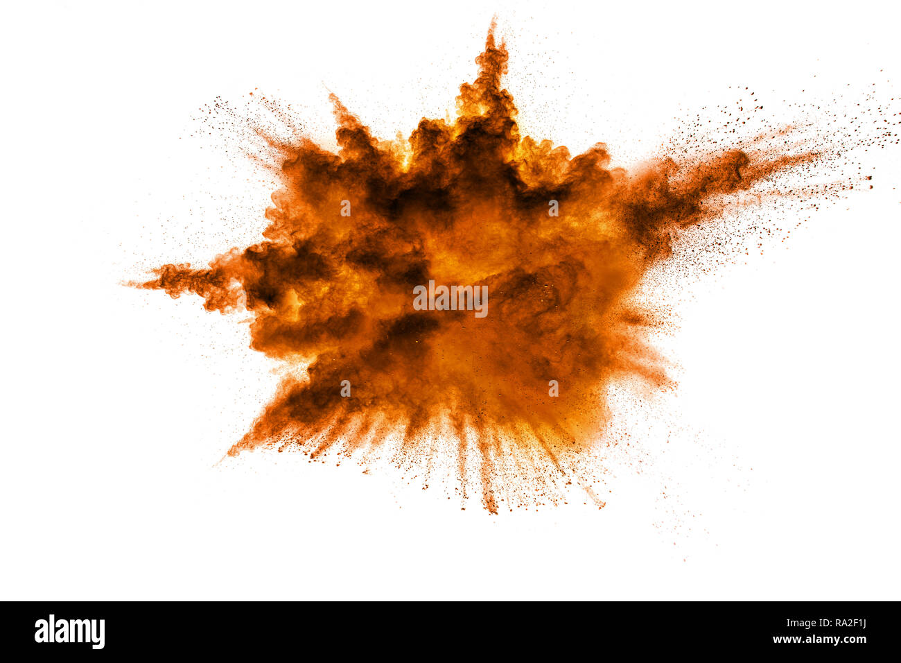 abstract orange powder explosion on  white background. abstract orange dust splattered on clear background. Freeze motion of orange powder splash. Pai Stock Photo