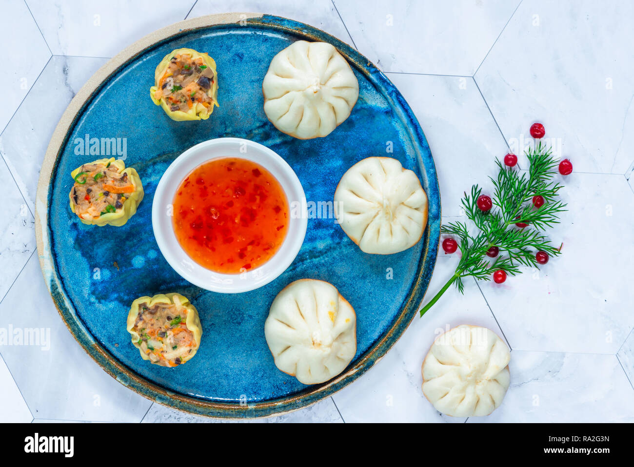 Selection of mini Chinese dumplings dim sum with sweet chili dipping