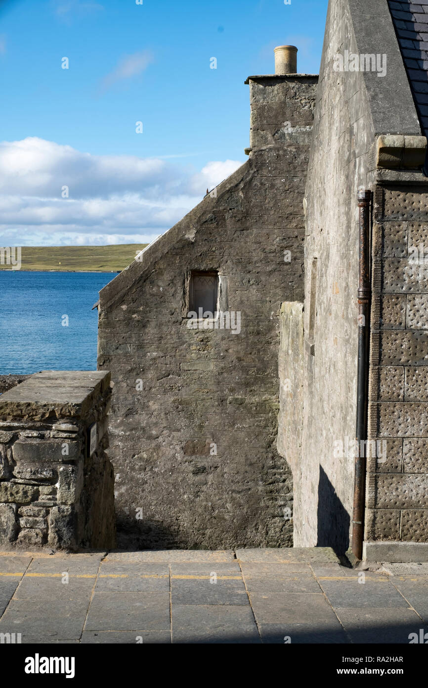 Architectural detail of the housing stock in the center of Lerwick, Shetland Islands, Scotland on a sunny day overlooking the sea Stock Photo