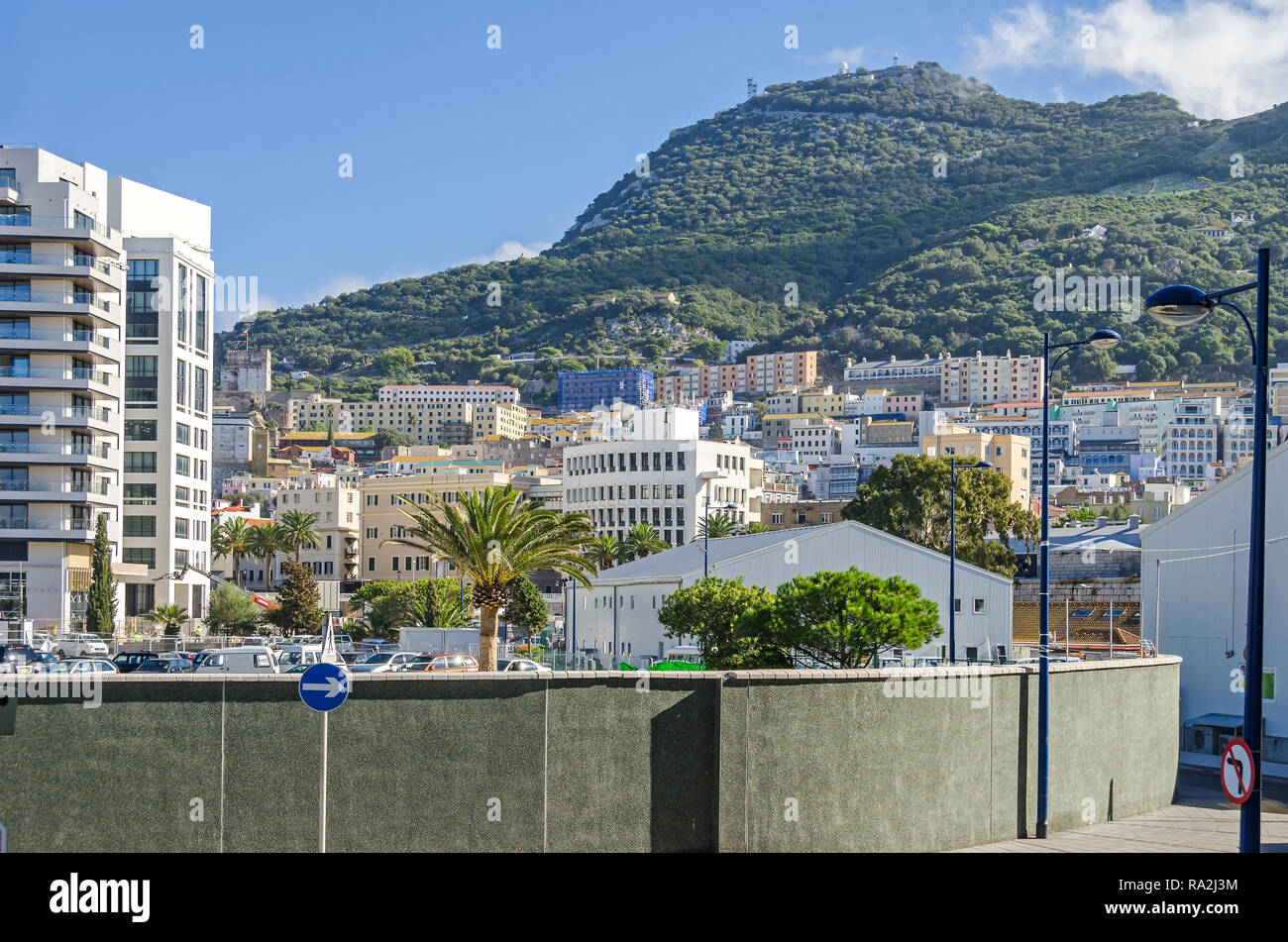 Gibraltar, British Overseas Territory -  November 8, 2018: Rock of Gibraltar and a densely populated town area with residential apartments Stock Photo