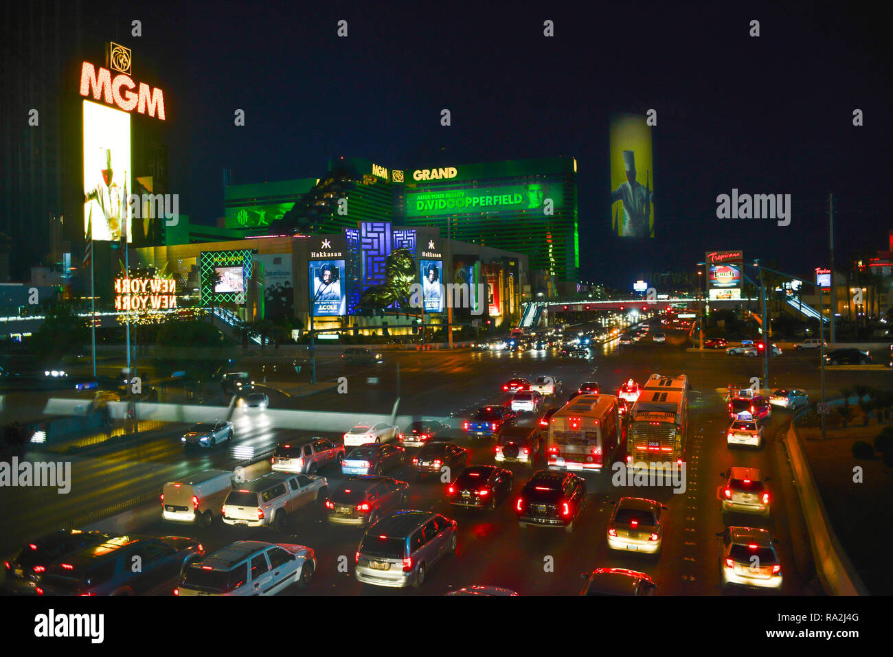 The Las Vegas, NV strip at night, busy with traffic, viewed from a pedestrian bridge of Neon lights and marquees for Casinos and Hotels on the Strip Stock Photo