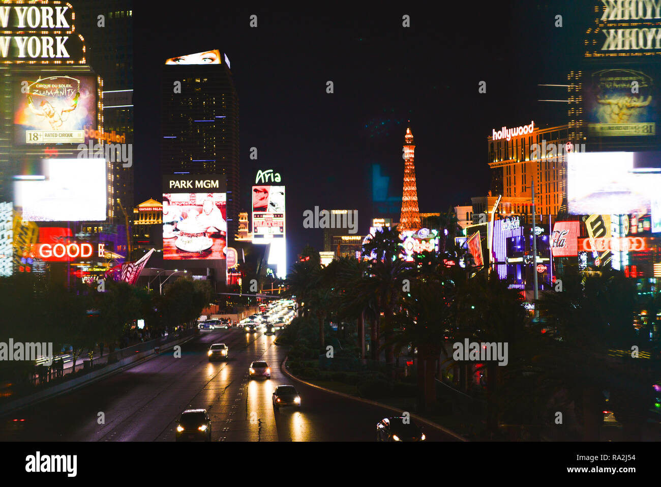 The Las Vegas, NV strip at night, busy with traffic, viewed from a pedestrian bridge of Neon lights and marquees for Casinos and Hotels on the Strip Stock Photo