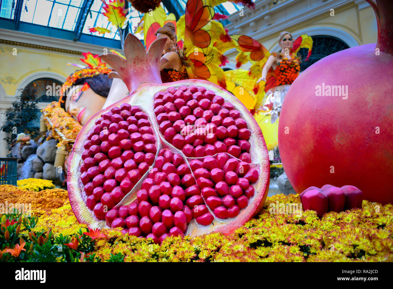 Charming display in the Harvest theme at the Bellagio Hotel and Casino's Conservatory and Botanical Garden with an oversized sleeping nymph decorated Stock Photo