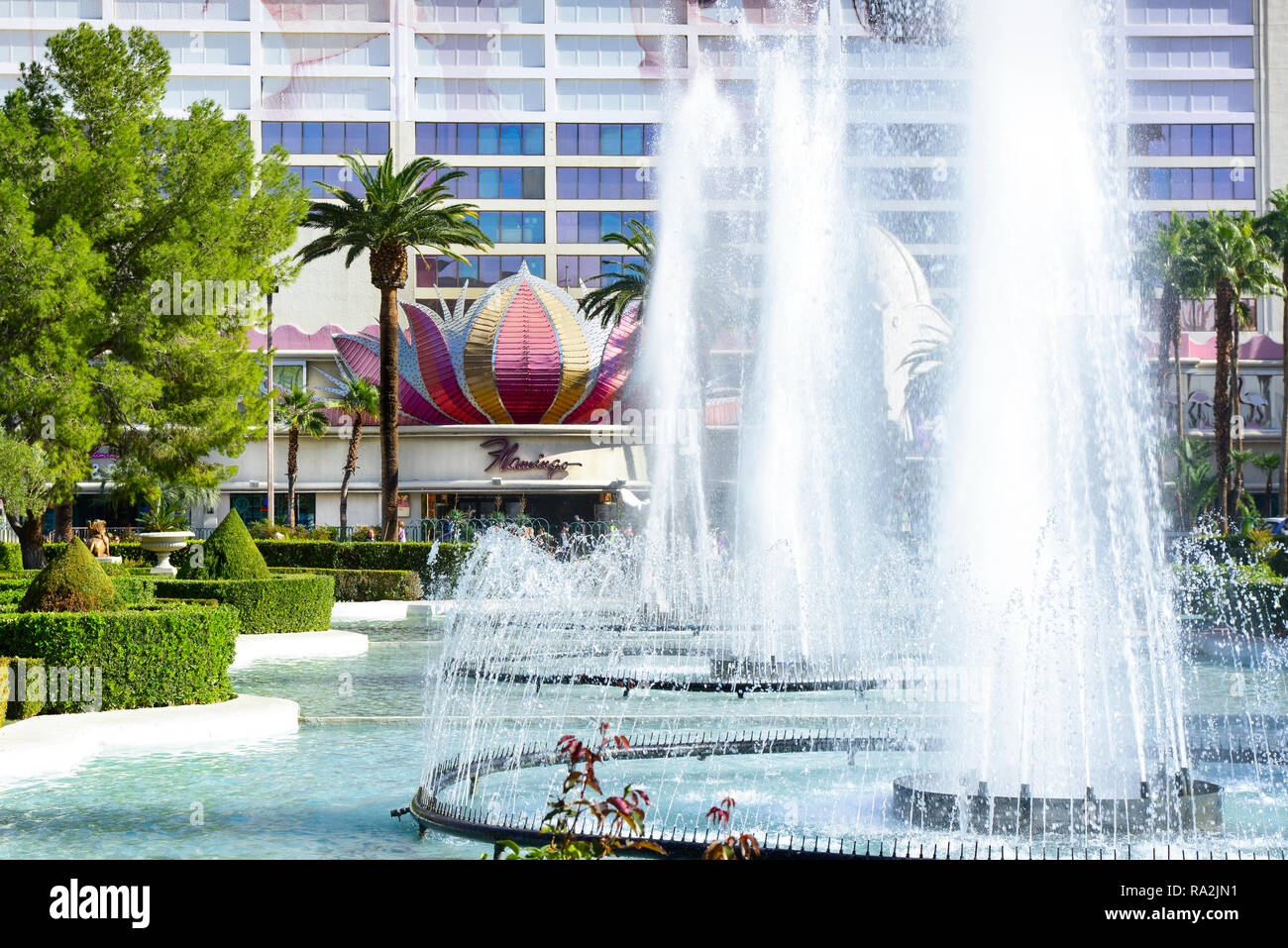 Water Fountains in front of Caesars Palace Hotel and Casino with a view across the Las Vegas Strip to the old school hotel, The Flamingo, in Las Vegas Stock Photo