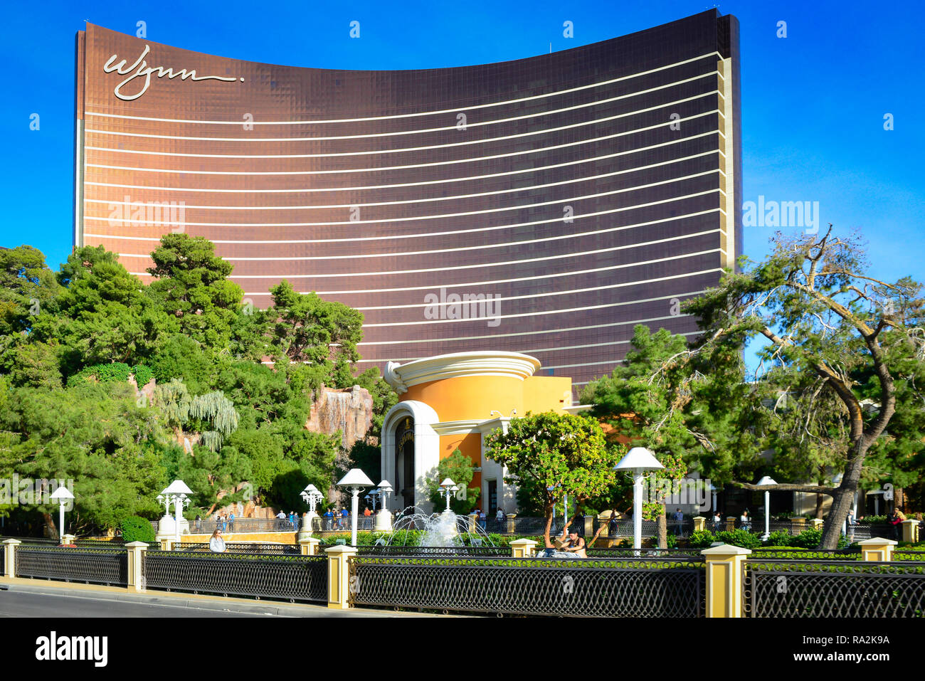 A green park greets vistors to the Wynn Resort Hotel and Casino  with water fountains on the strip in Las Vegas, NV Stock Photo