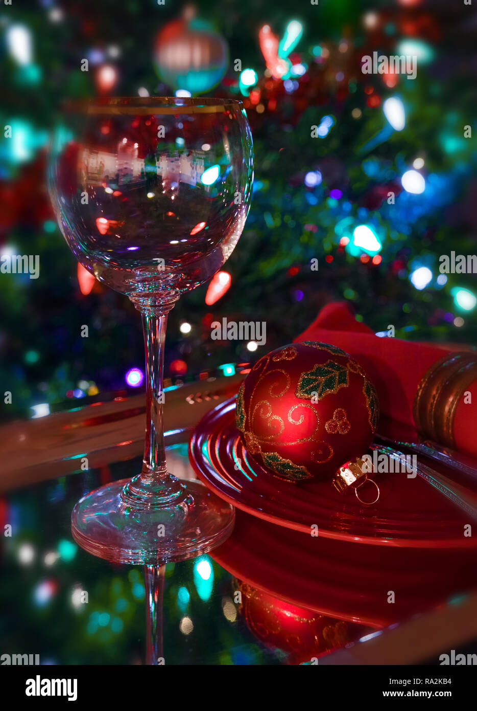 A richly decorated table for the Christmas party or New Year's Eve. Christmas tree in the background. Stock Photo