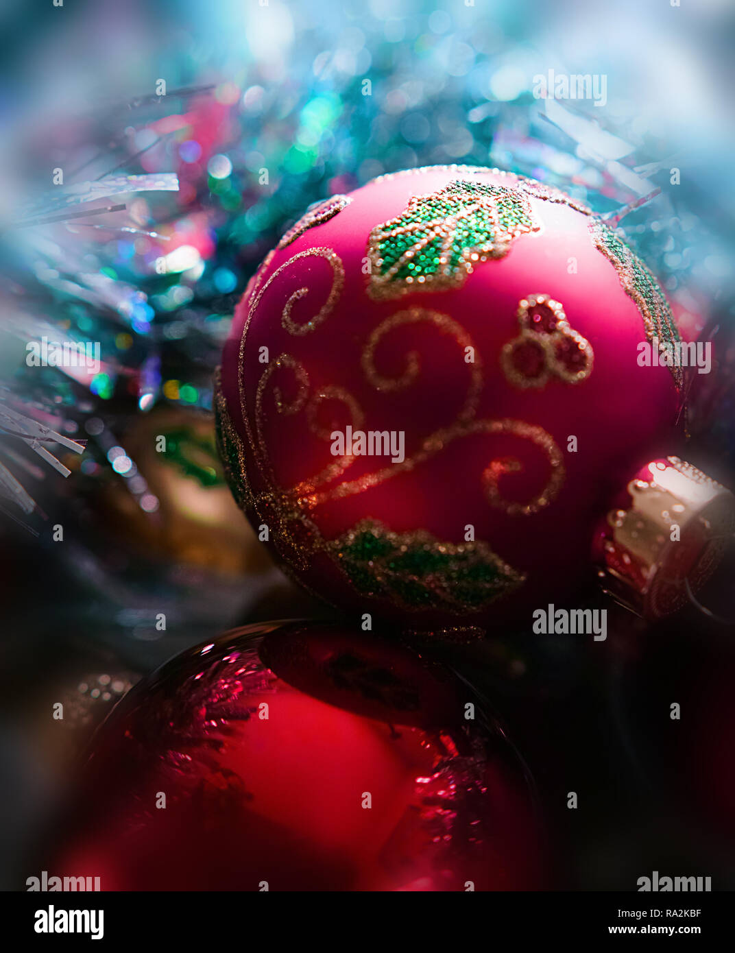 Two red Christmas balls in close up, party ambience. Close-up. Stock Photo