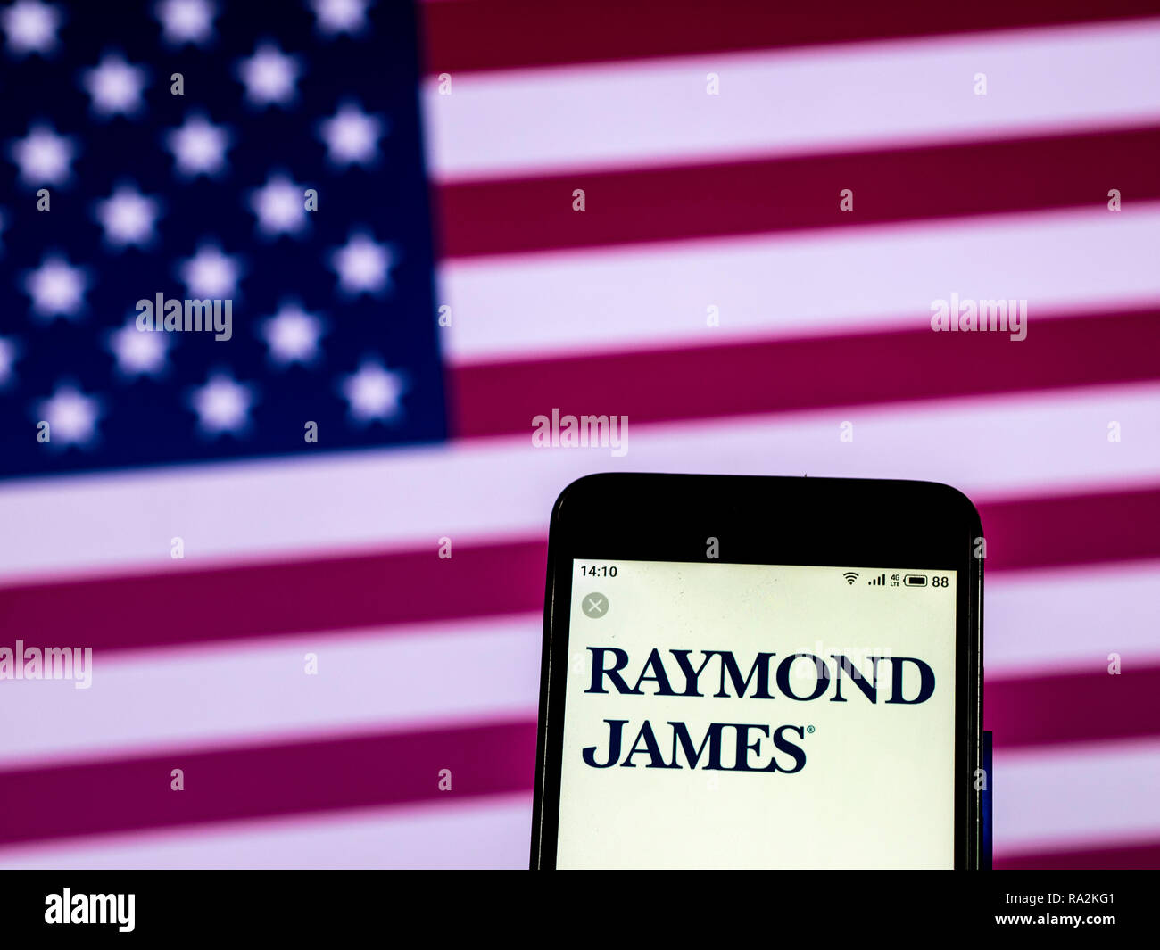 Raymond James Investment banking company logo seen displayed on smart