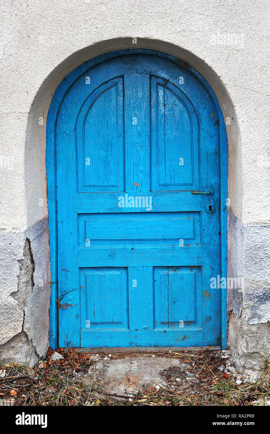 cute small old door paited blue, architectural background for your design Stock Photo