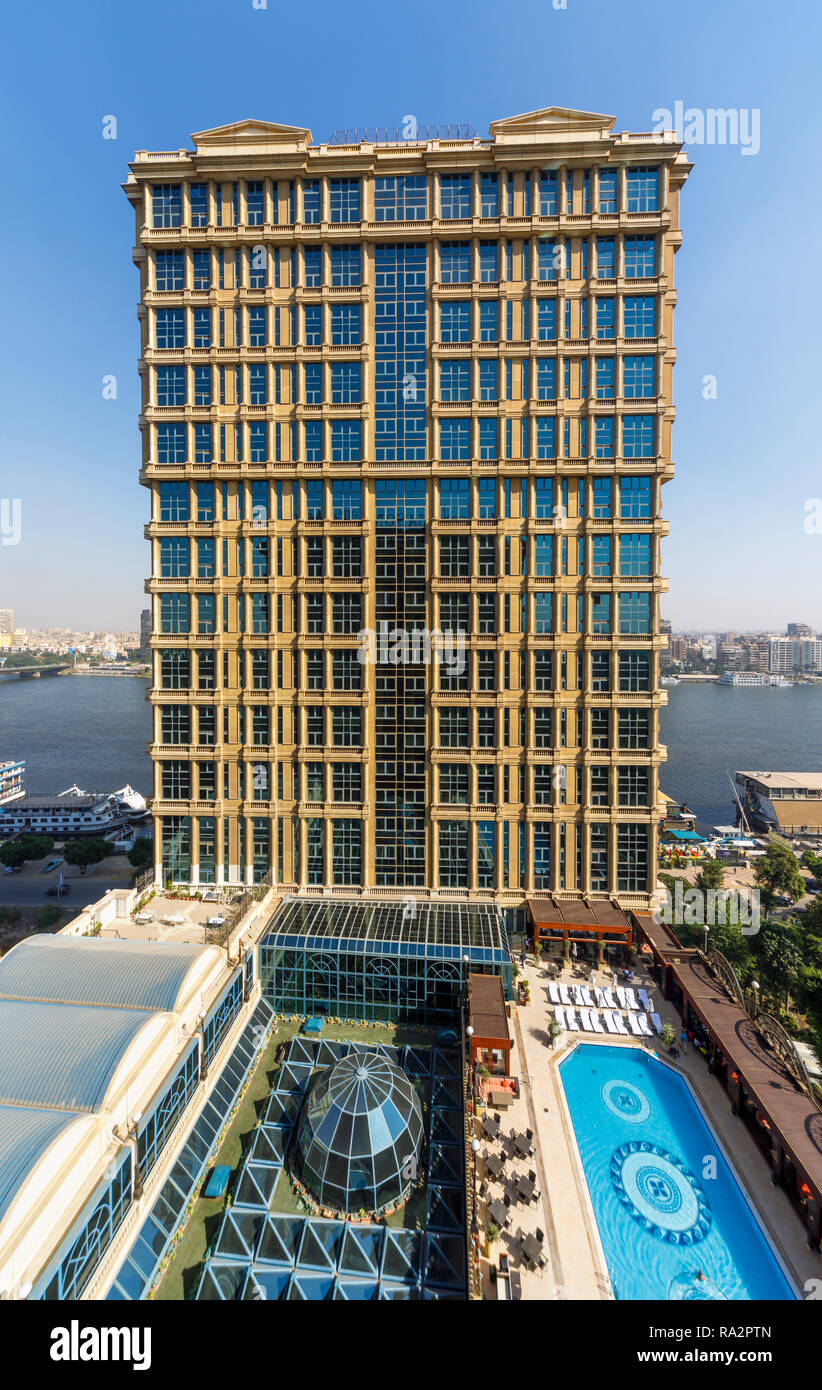 Exterior of the luxurious 5 star Cairo At The First Residence Four Seasons  Hotel, Giza, Cairo, Egypt and view of swimming pool on a sunny day Stock  Photo - Alamy