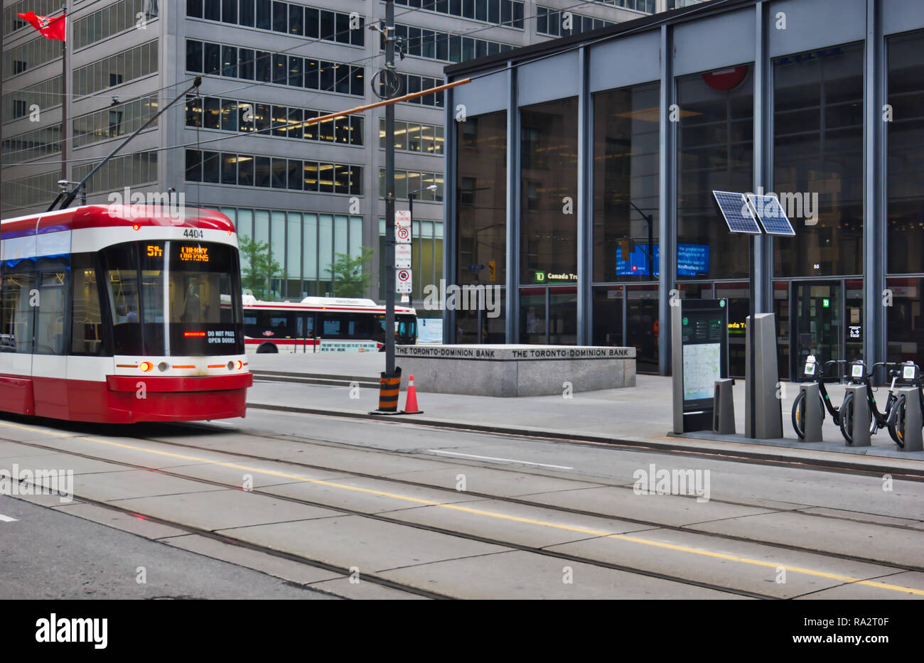 Tram, bike dock and solar panels in street, Toronto, Ontario, Canada Stock Photo