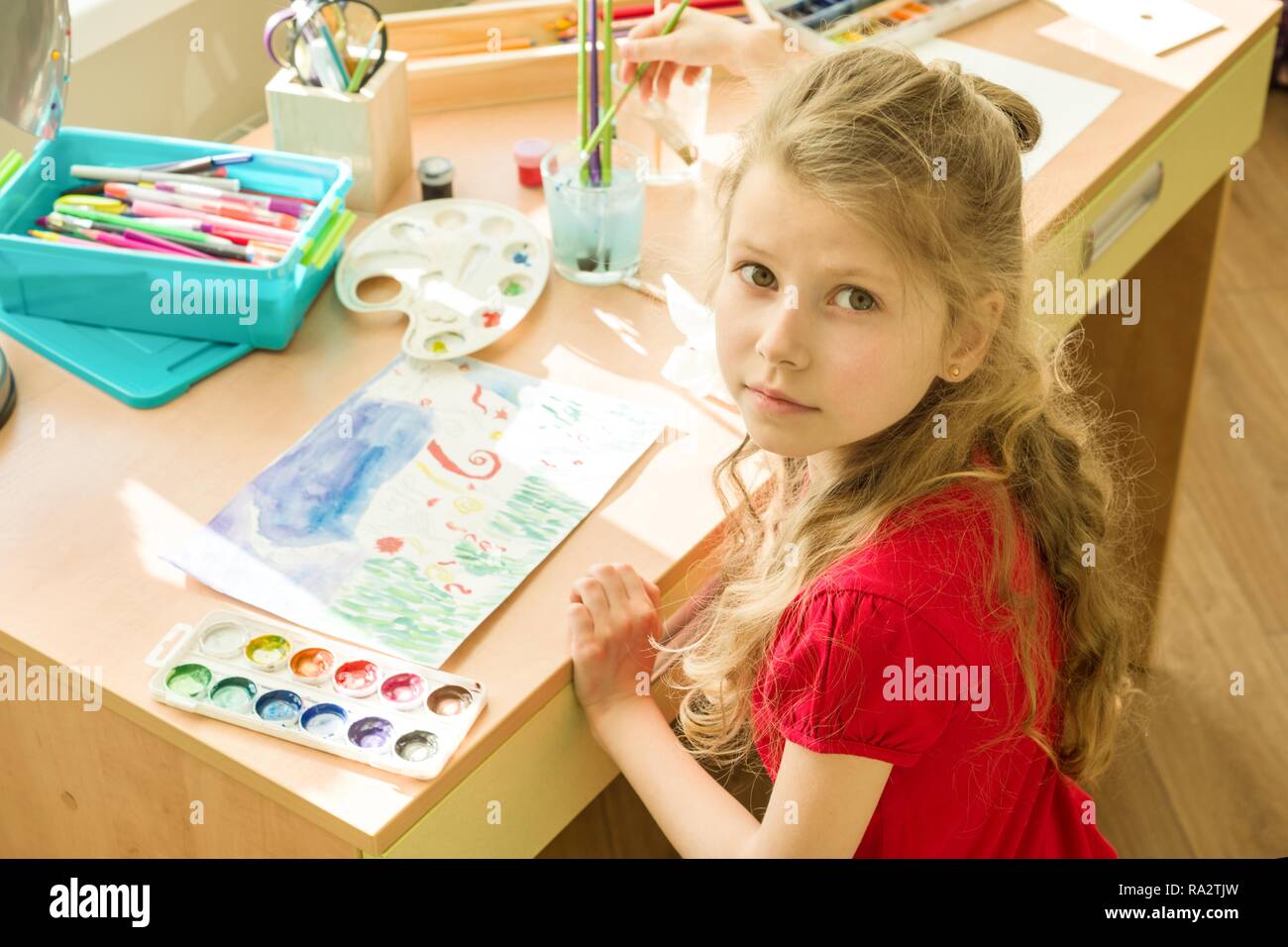 Girl Child 7 Years Old Drawing Watercolor At The Table At Home Child girl-child-7-years-old-drawing-watercolor-at-the-table-at-home-child